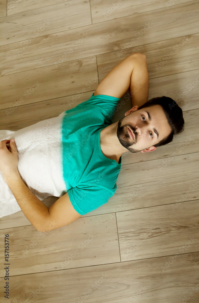 Lying on the floor. Lying on the floor.