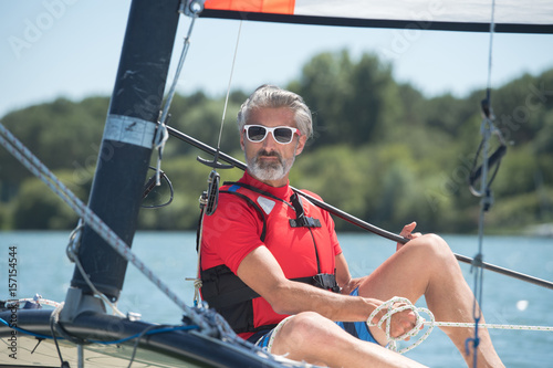 Senior man on sail boat