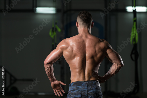 Muscular Body Builder Showing His Back Lat Spread