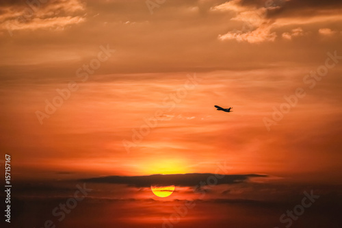 Airplane in sunset sky © songphon