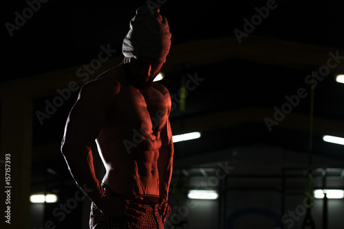 Silhouette Bodybuilder Flexing Muscles