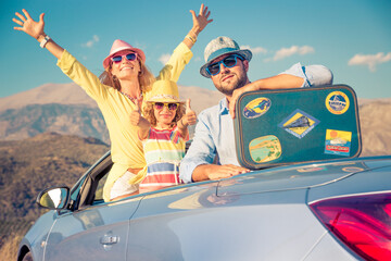 Happy family travel by car in the mountains