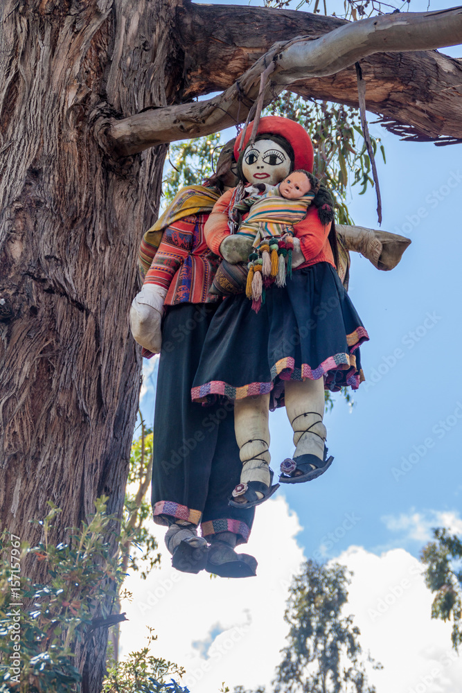 Stuffed puppets hanging on a tree at Inca's ruins of Q'enqo near Cuzco, Peru.