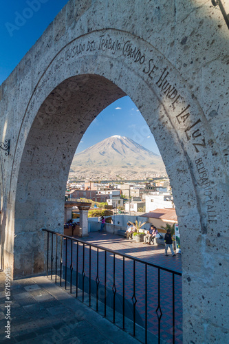 AREQUIPA, PERU - MAY 30, 2015: Misti volcano and arches at Yanahuara square in Arequipa, Peru photo