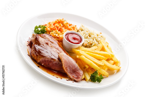 Grilled steak with french fries on white background 