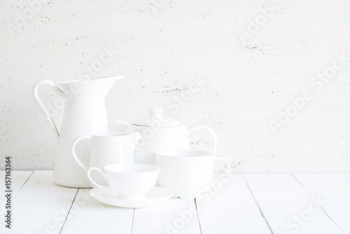Clean cups on wood background.