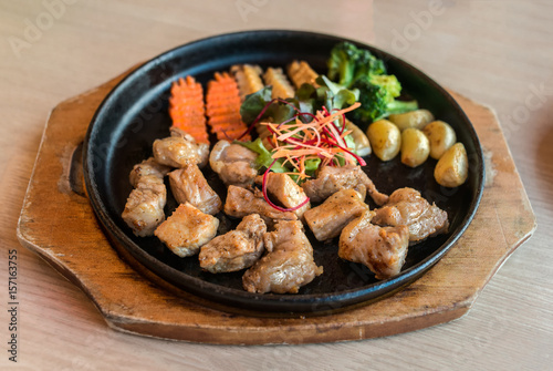 Pork Steak with vegetables in hot pan,teppanyaki Japanese food style
