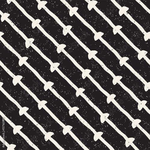 Hand drawn style ethnic seamless pattern. Abstract geometric tiling background in black and white. Vector freehand doodle texture.