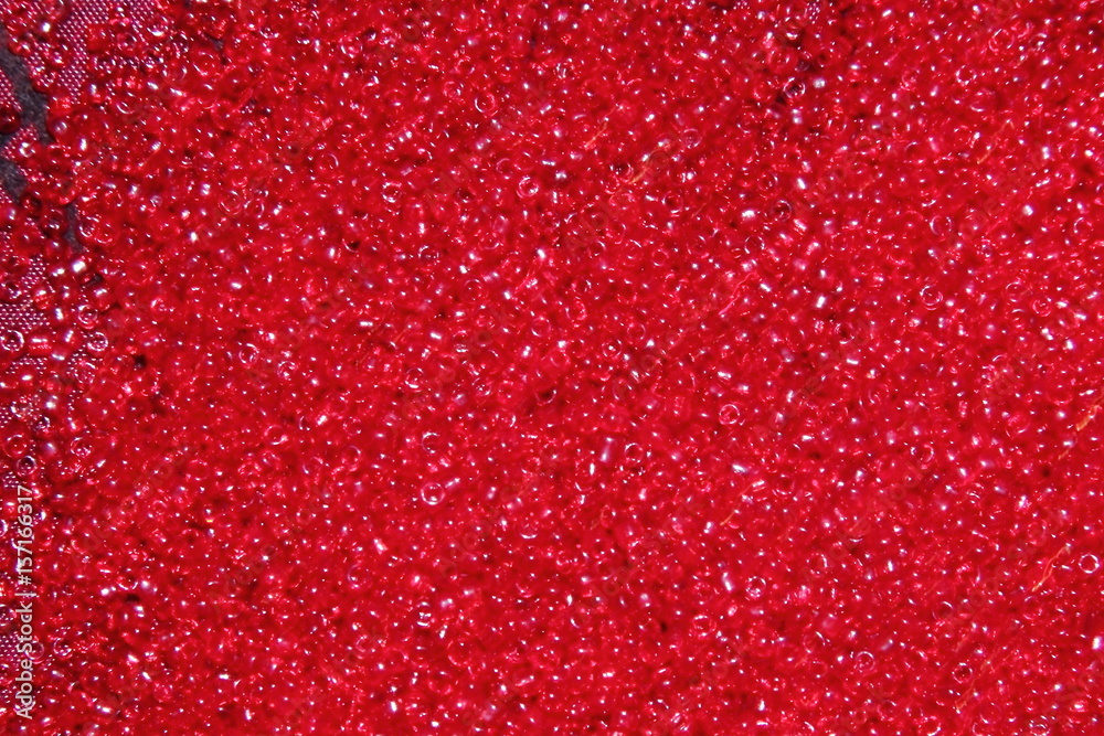 Crimson-red glass beads background - closeup beads texture Crimson-red glass beads background - closeup beads texture