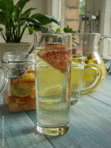 Detox citrus infused flavored water. - homemade cocktail with lemon, lime, grapefruit and mint