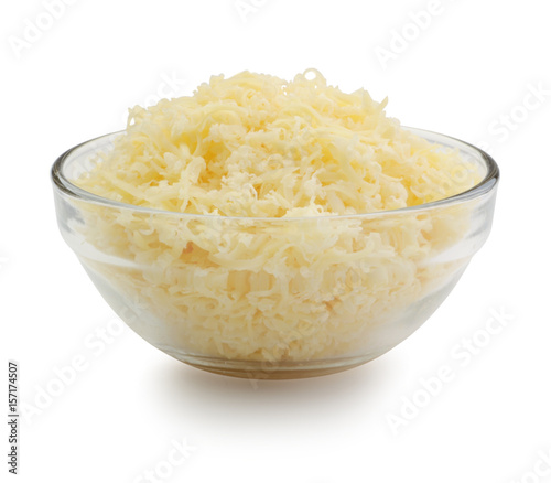 Grated cheese in a glass bowl isolated
