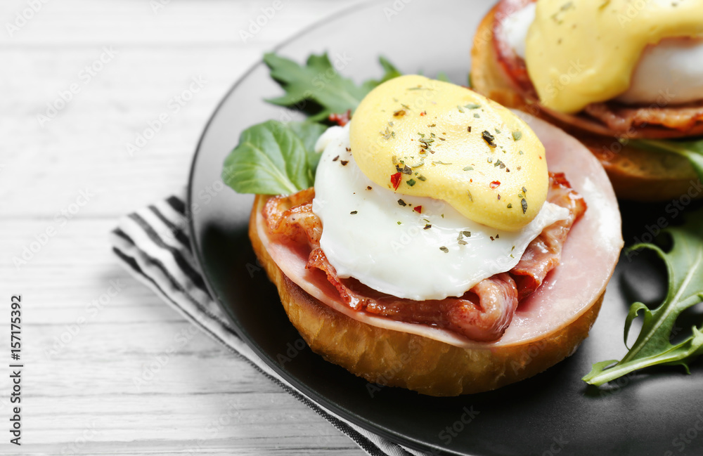 Tasty eggs Benedict on plate Tasty eggs Benedict on plate