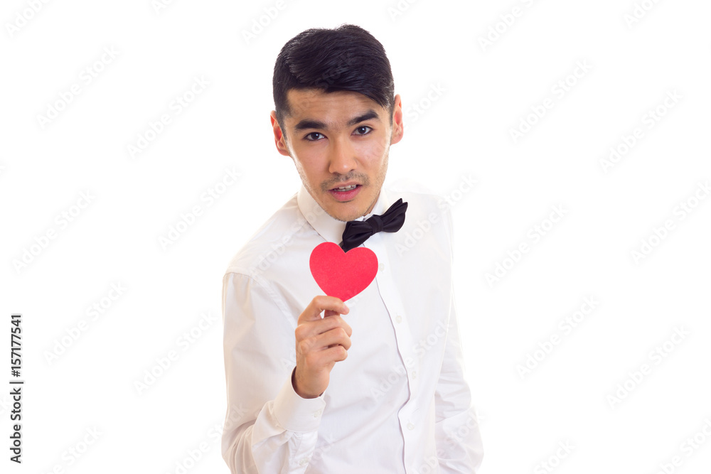 Young man holding a read heart Young man holding a read heart