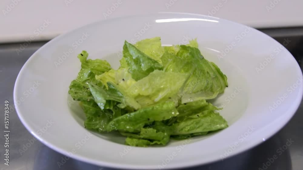 chef preparing a salad. Spread tomatoes onion falls chef preparing a salad. Spread tomatoes onion falls