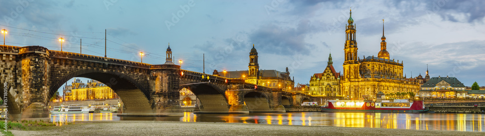  view of the historic part of Dresden, city lights reflecting on the River Elbe.