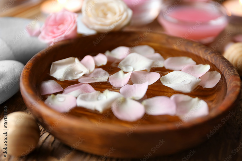 Bowl with water and rose petals, closeup Bowl with water and rose petals, closeup
