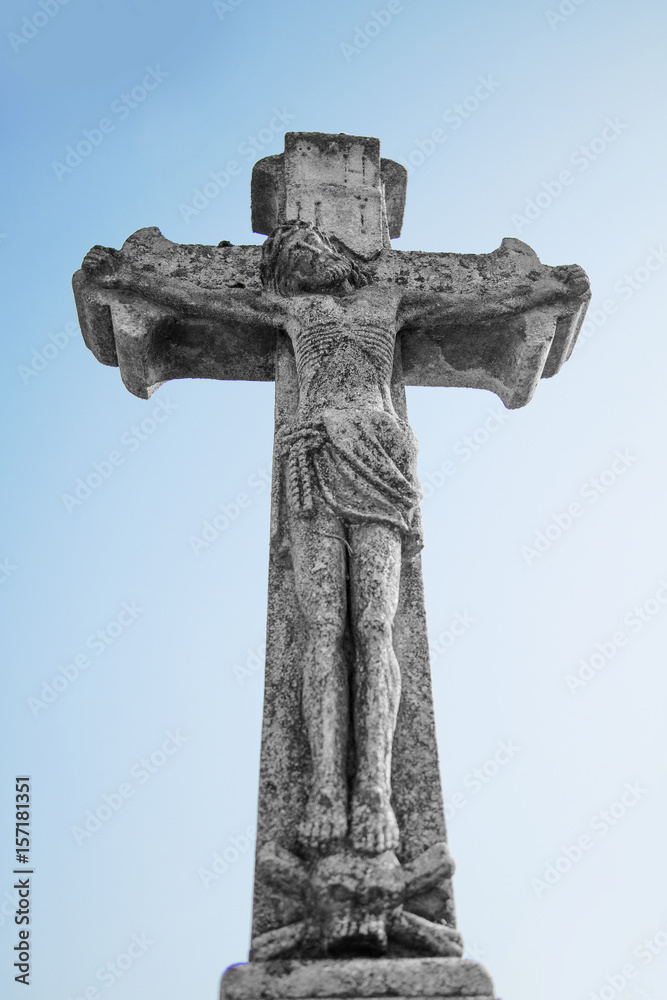 crucifixion of Jesus Christ as a symbol of resurrection and immortality of the human soul (ancient stone statue)