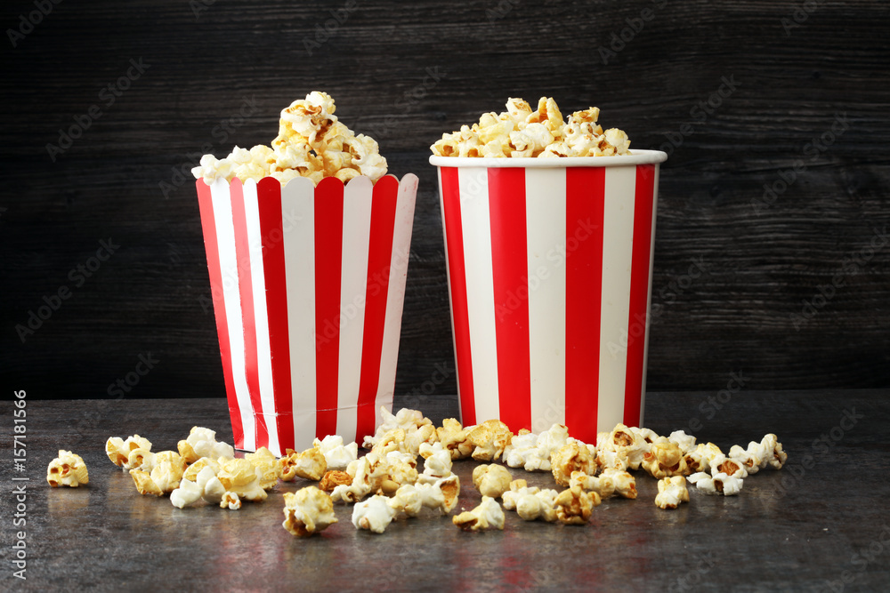 Cinema concept with popcorn in red white bag Cinema concept with popcorn in red white bag