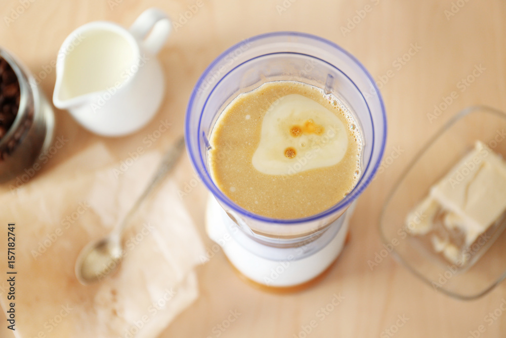 Freshly cooked coffee with butter in blender cup Freshly cooked coffee with butter in blender cup