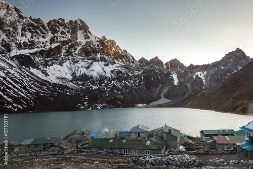 Gokyo village and the Gokyo lake in the background before sunrise. Sagarmatha National Park, Solukhumbu District in Nepal, Asia.  photo