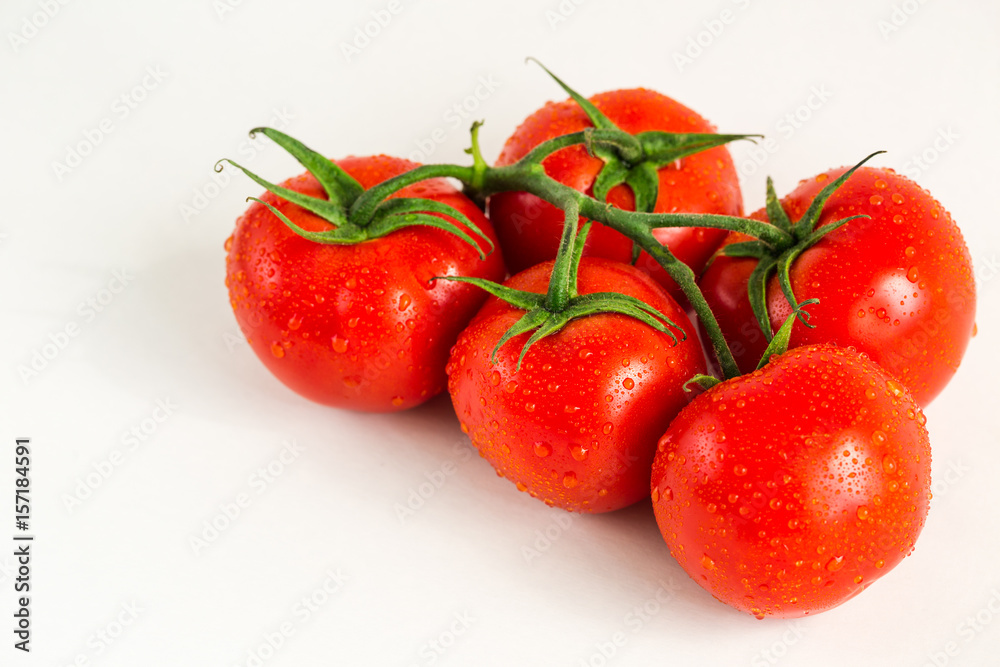 Red fresh tomatoes isolated on white background