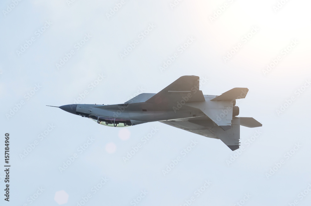 Foto Stock Combat aircraft fighter jet fly upside down. Adobe Stock