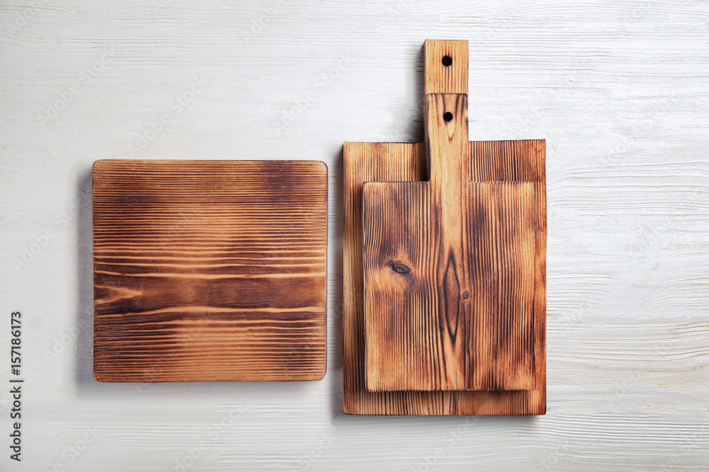 Fototapeta premium Set of cutting boards on white wooden background