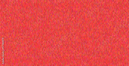 Bright knitted texture on red background.