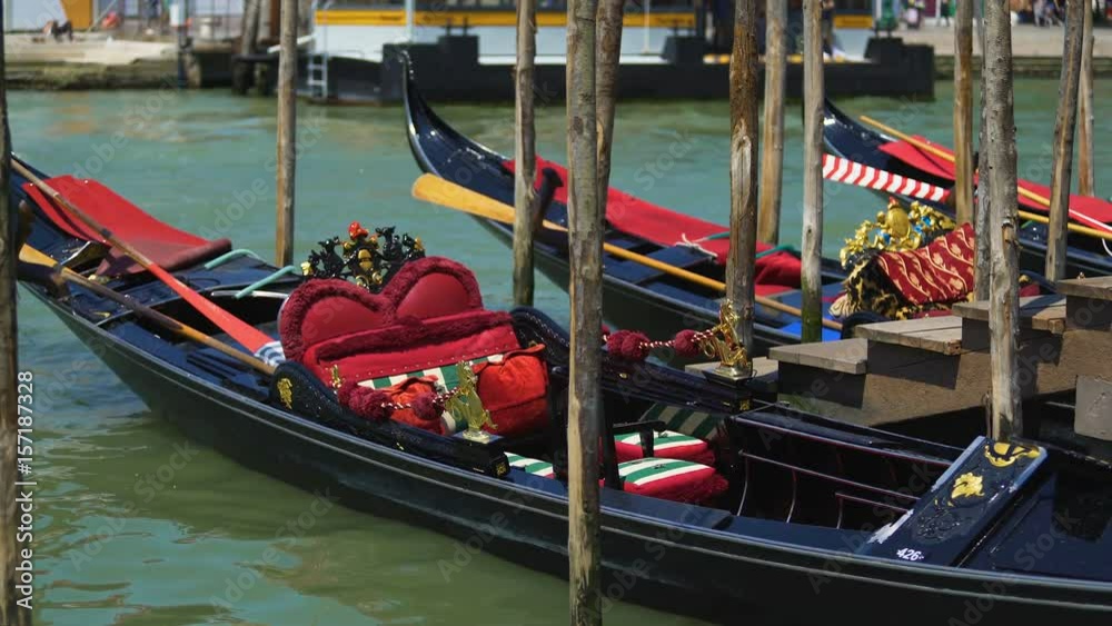 Romantic gondolas moored at Grand Canal, traditional venetian transport, travel Romantic gondolas moored at Grand Canal, traditional venetian transport, travel