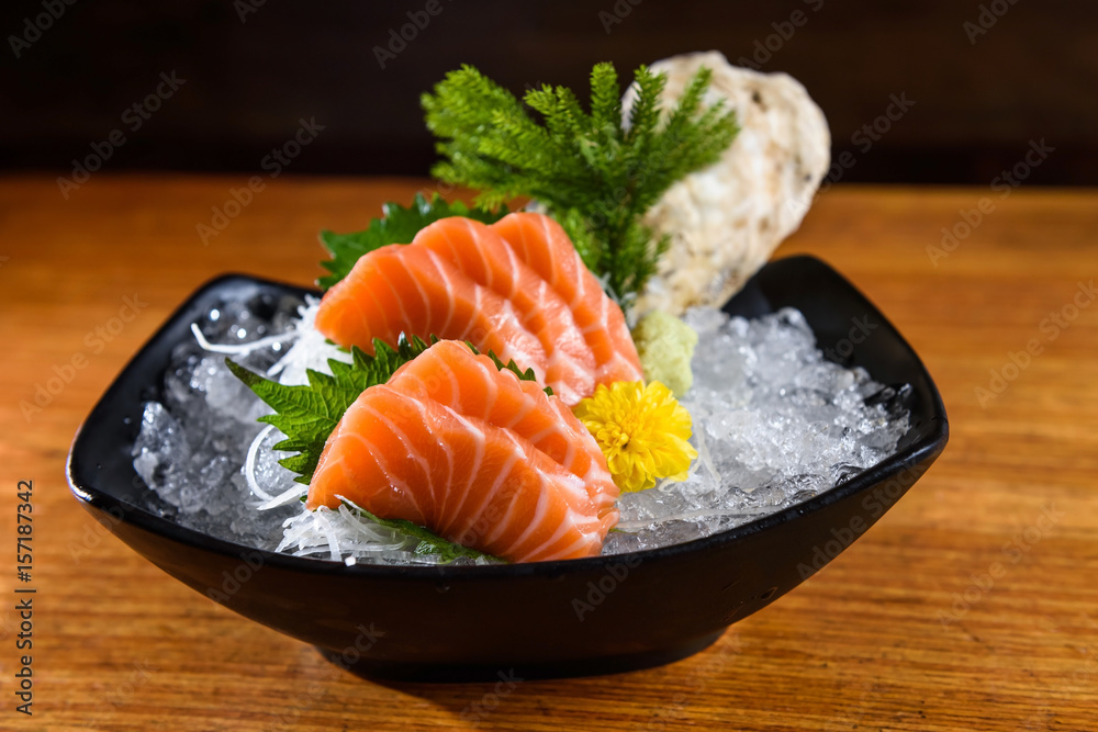 Fresh salmon sashimi on wooden table Fresh salmon sashimi on wooden table