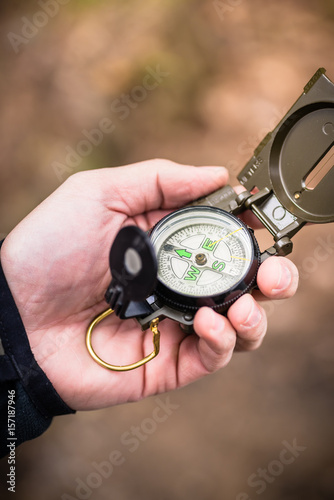 Hiker using compass for orientation
