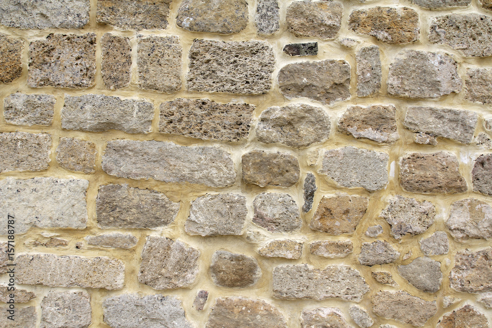 Pattern of flat stones. Grey stone wall background. Surface stone wall background. Pattern of flat stones. Grey stone wall background. Surface stone wall background.