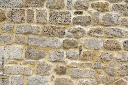 Pattern of flat stones. Grey stone wall background. Surface stone wall background.