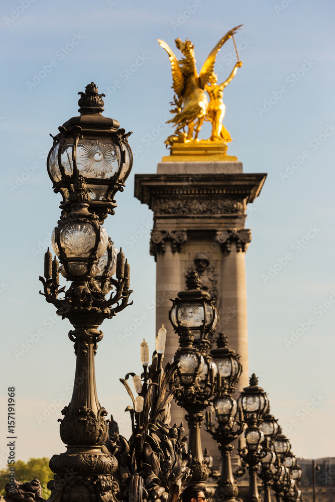  Street lamps and status of Pont Alexandre III in a sunny day