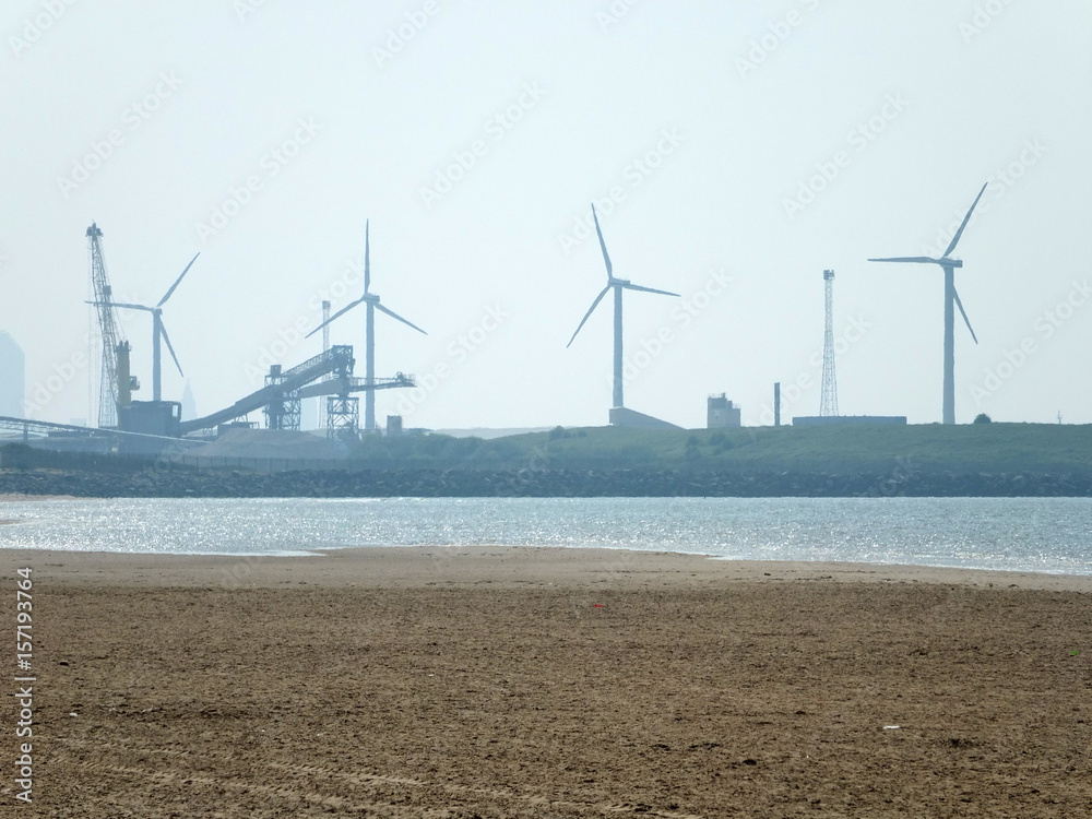 cosby beach near liverpool with industry and wind turbines