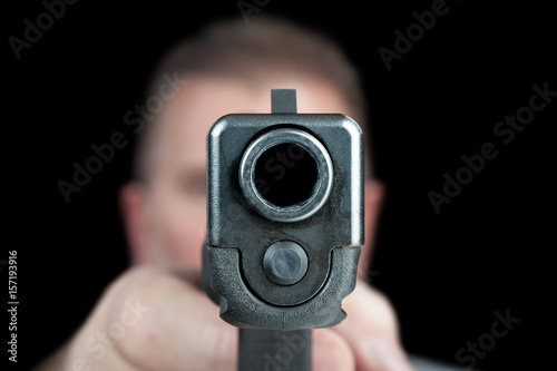 Man pointing gun