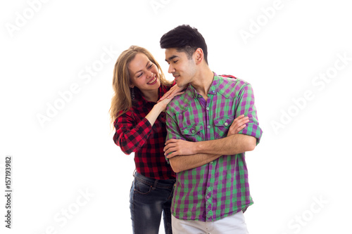 Young couple in plaid shirts