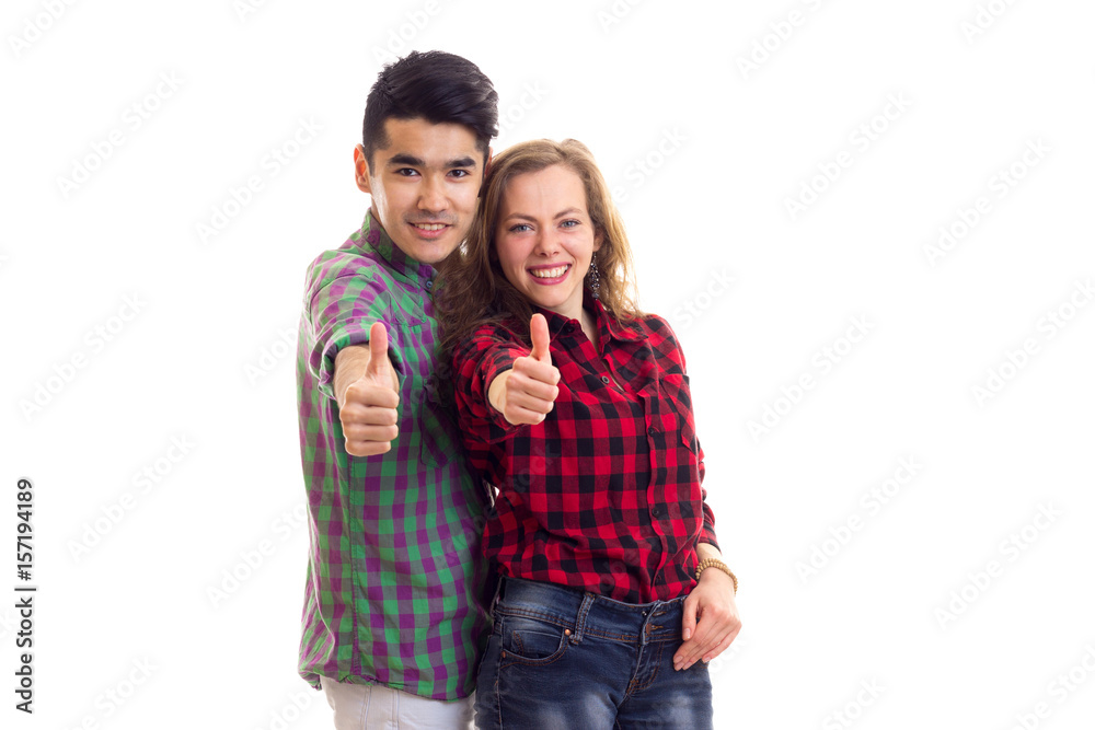Young couple in plaid shirts Young couple in plaid shirts