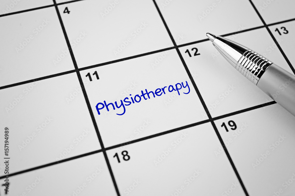 Pen on calendar, closeup. Physiotherapy concept Pen on calendar, closeup. Physiotherapy concept