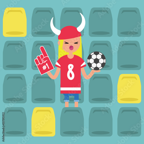 Young blond girl wearing horned hat and foam finger at the stadium / flat editable vector illustration, clip art