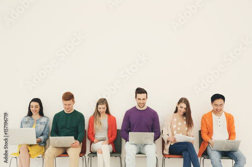 Young people with gadgets s...