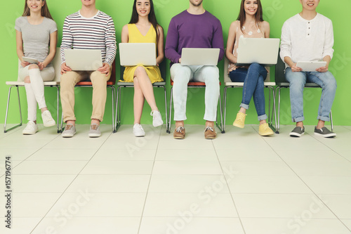 Young people with gadgets s...
