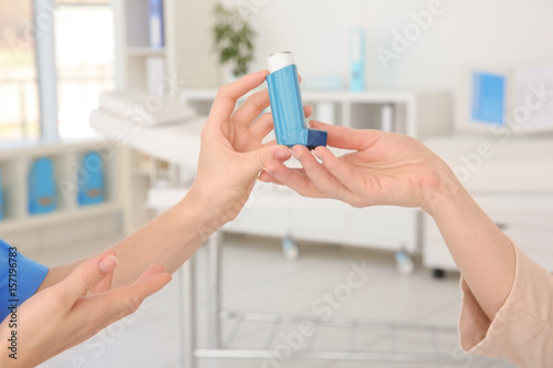 Doctor giving adult woman i...