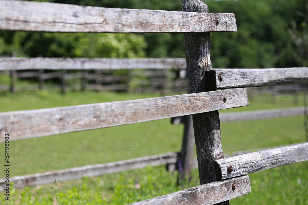 Closeup of wooden fence on a corral farmland rural scene Closeup of wooden fence on a corral farmland rural scene