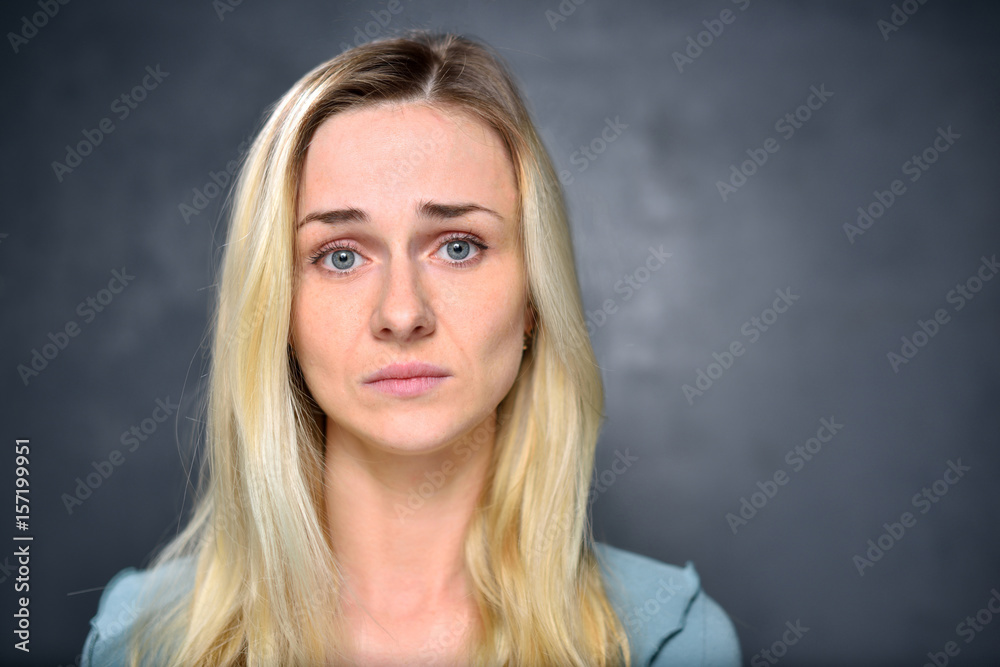 Portrait of a girl blonde, disappointed woman, closeup Portrait of a girl blonde, disappointed woman, closeup