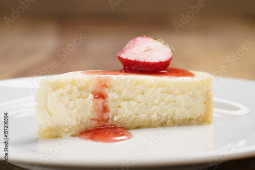 cheesecake with strawberry on plate closeup  shallow focus