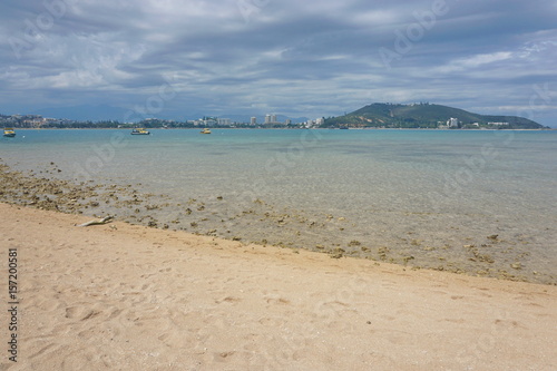 Coastline of the Anse Vata and the city of Noumea seen from the beach of islet Canard, southwest coast of Grande Terre island, New Caledonia, south Pacific ocean, Oceania