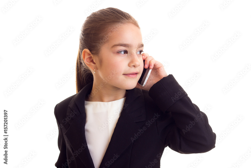 Little girl in black jacket talking on the phone Little girl in black jacket talking on the phone