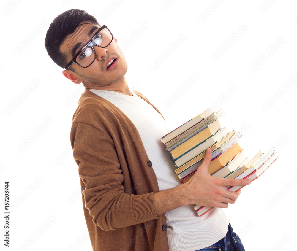 Young man in glasses with books