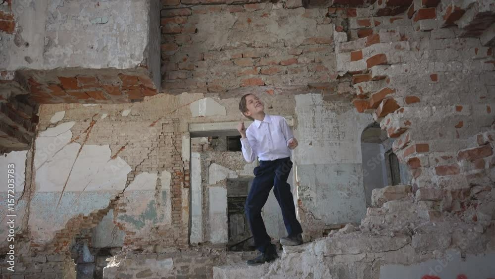 Boy dances in an abandoned house Boy dances in an abandoned house